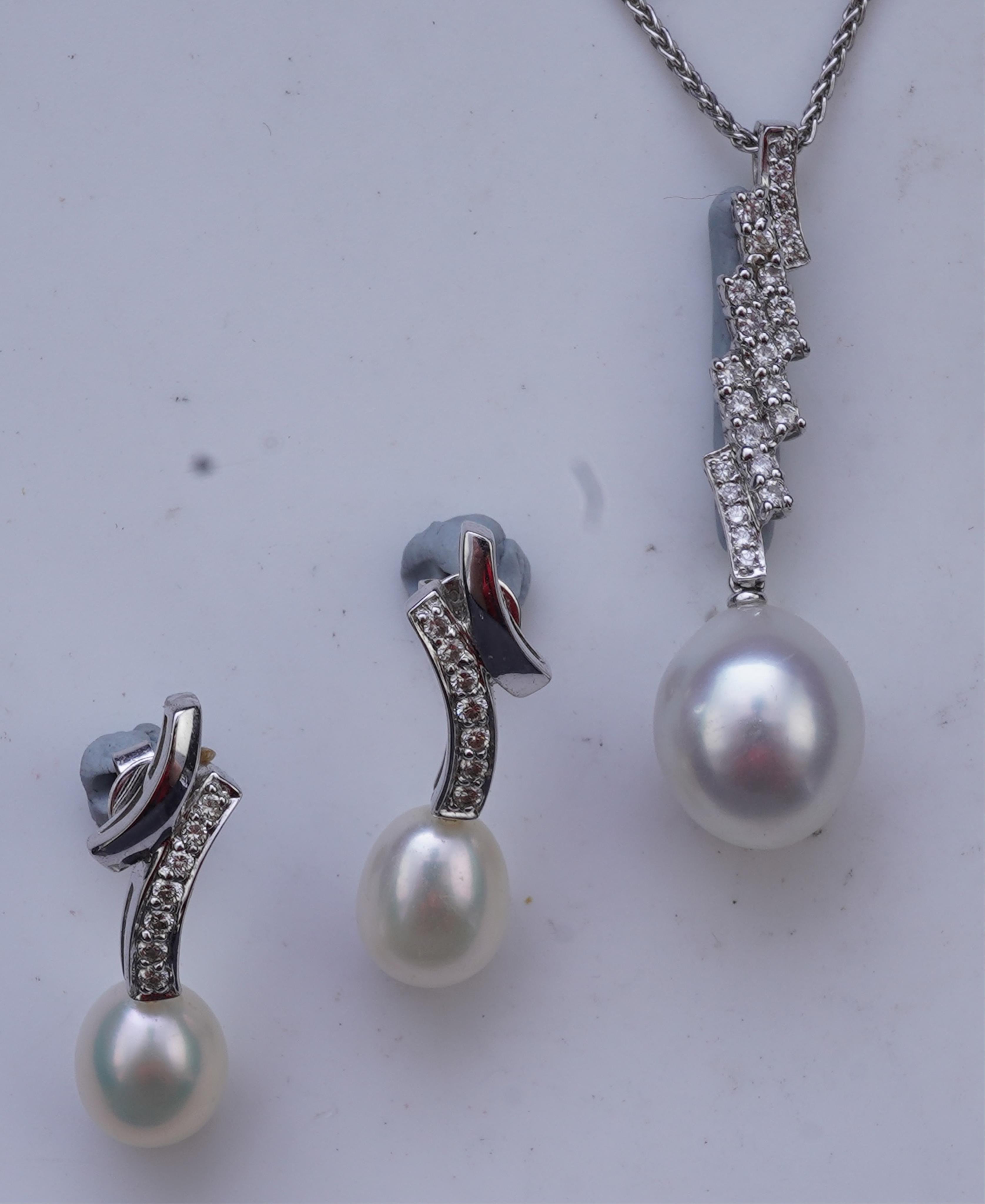 A cultured pearl and diamond demi-parure